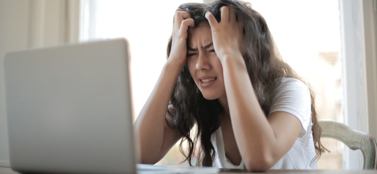 Decorative image depicting user frustration. Photo by Andrea Piacquadio: https://www.pexels.com/photo/woman-in-white-shirt-showing-frustration-3807738/