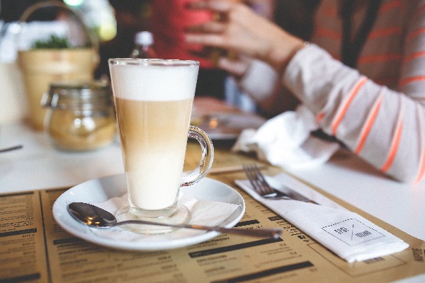 Image of cafe table with cappuccino 
