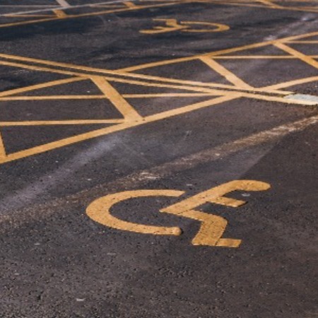 Decorative image depicting photo-disabled-parking-signs-on-asphalt-pavement